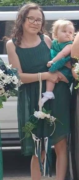 Bridesmaid holding a floral hoop bouquet alternative