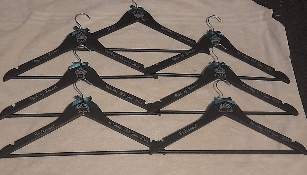 Personalised black wedding coat hangers with names and roles